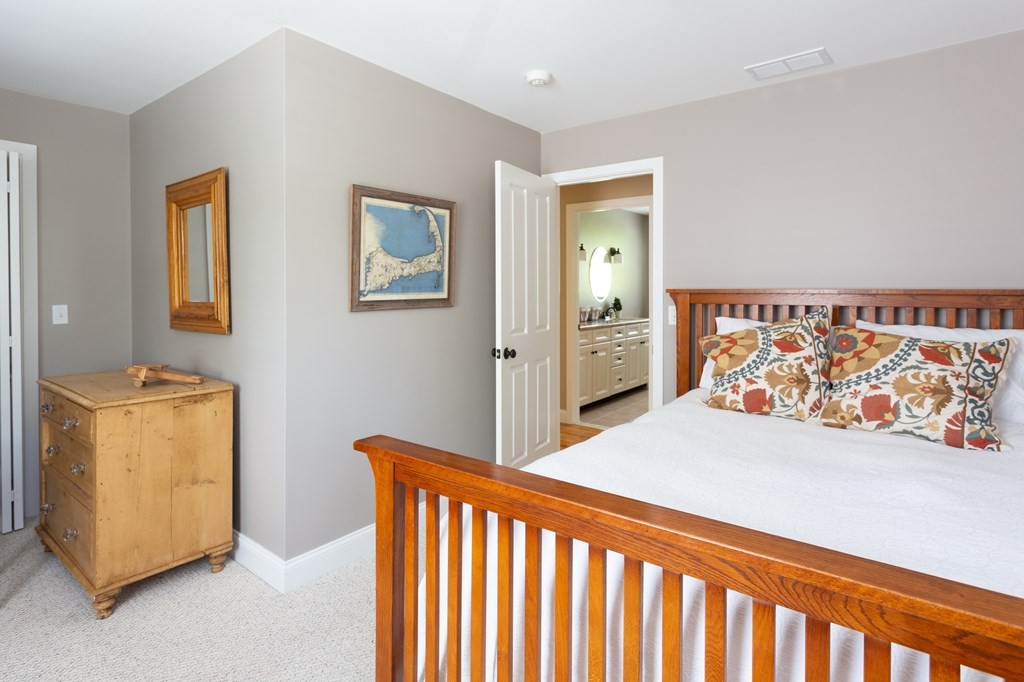 6 North Street Mashpee, MA 02649 - Photo 17 of 22 a bedroom with a bed and a couch