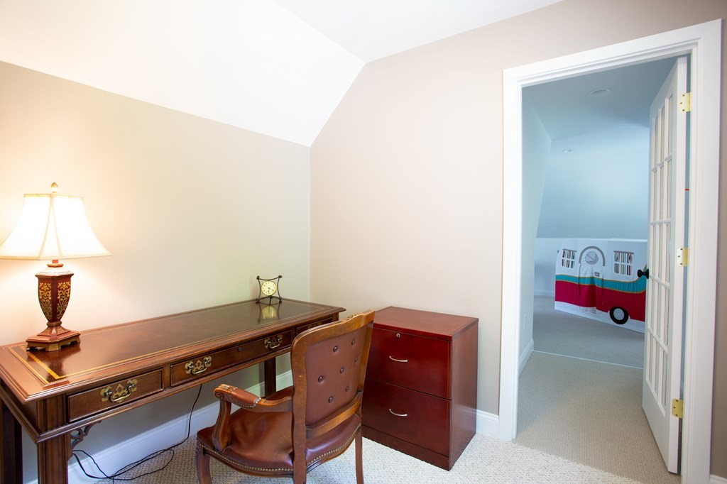 6 North Street Mashpee, MA 02649 - Photo 18 of 22 a room with a table and a lamp