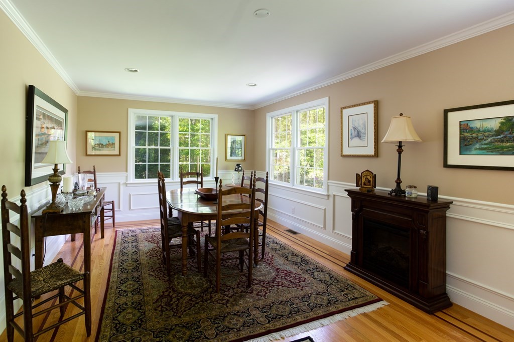 6 North Street Mashpee, MA 02649 - Photo 7 of 22 a view of a dining room with furniture a rug and wooden floor