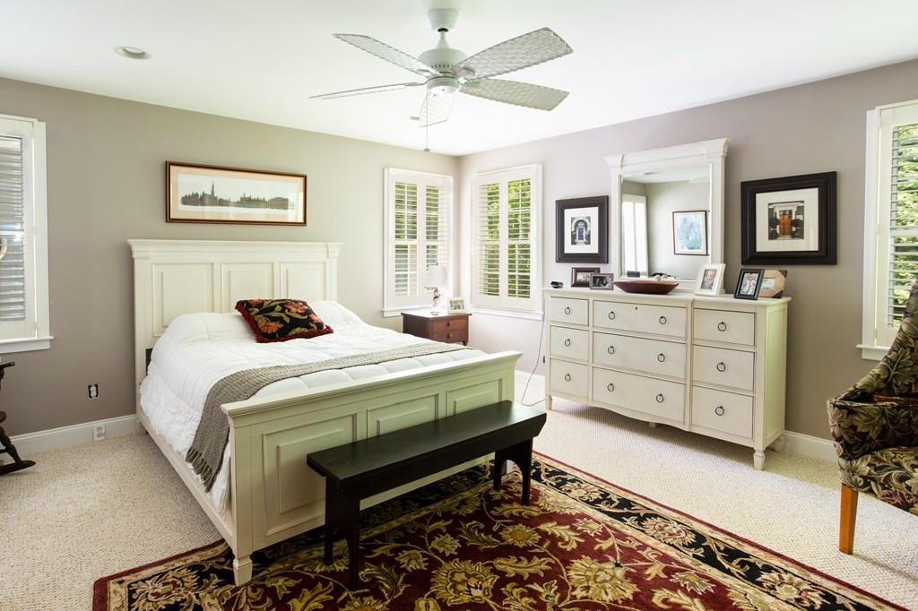 6 North Street Mashpee, MA 02649 - Photo 8 of 22 a bedroom with a bed and a dresser