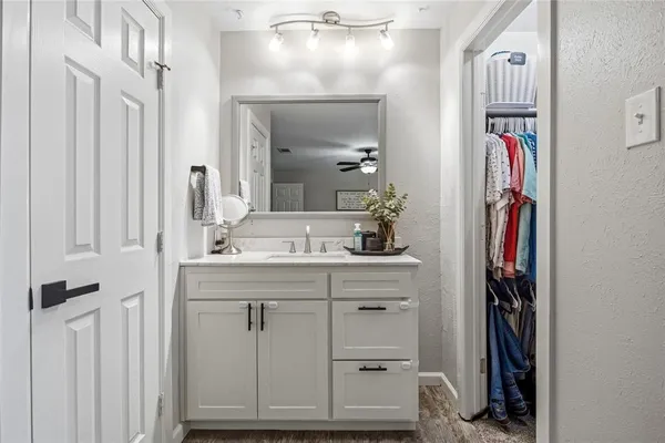 a bathroom with a mirror and a sink