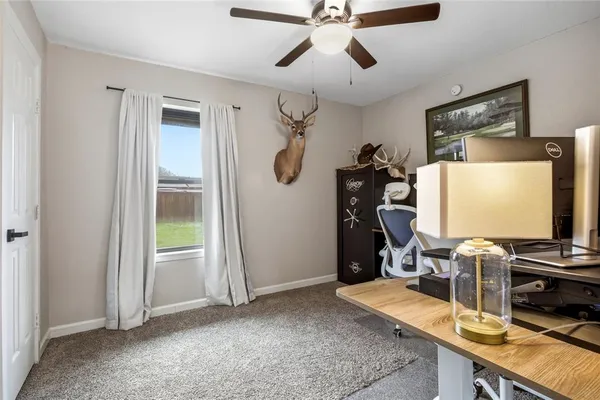 a room with gym equipment and a flat screen tv