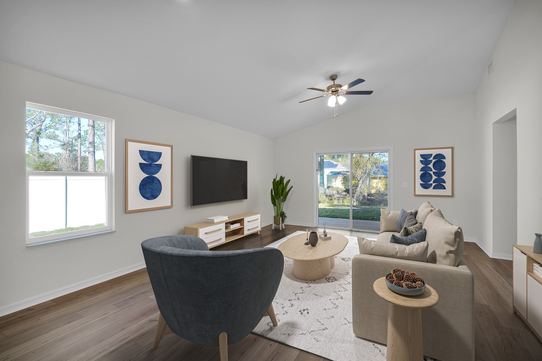37255 Whisper Way Hilliard, FL 32046 - Photo 4 of 6 a living room with furniture a flat screen tv and a window