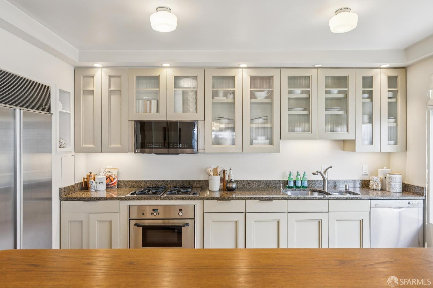 2100 Green Street, Unit 206 San Francisco, CA 94123 - Photo 11 of 33 a kitchen with stainless steel appliances granite countertop a stove a sink dishwasher a refrigerator and a stove
