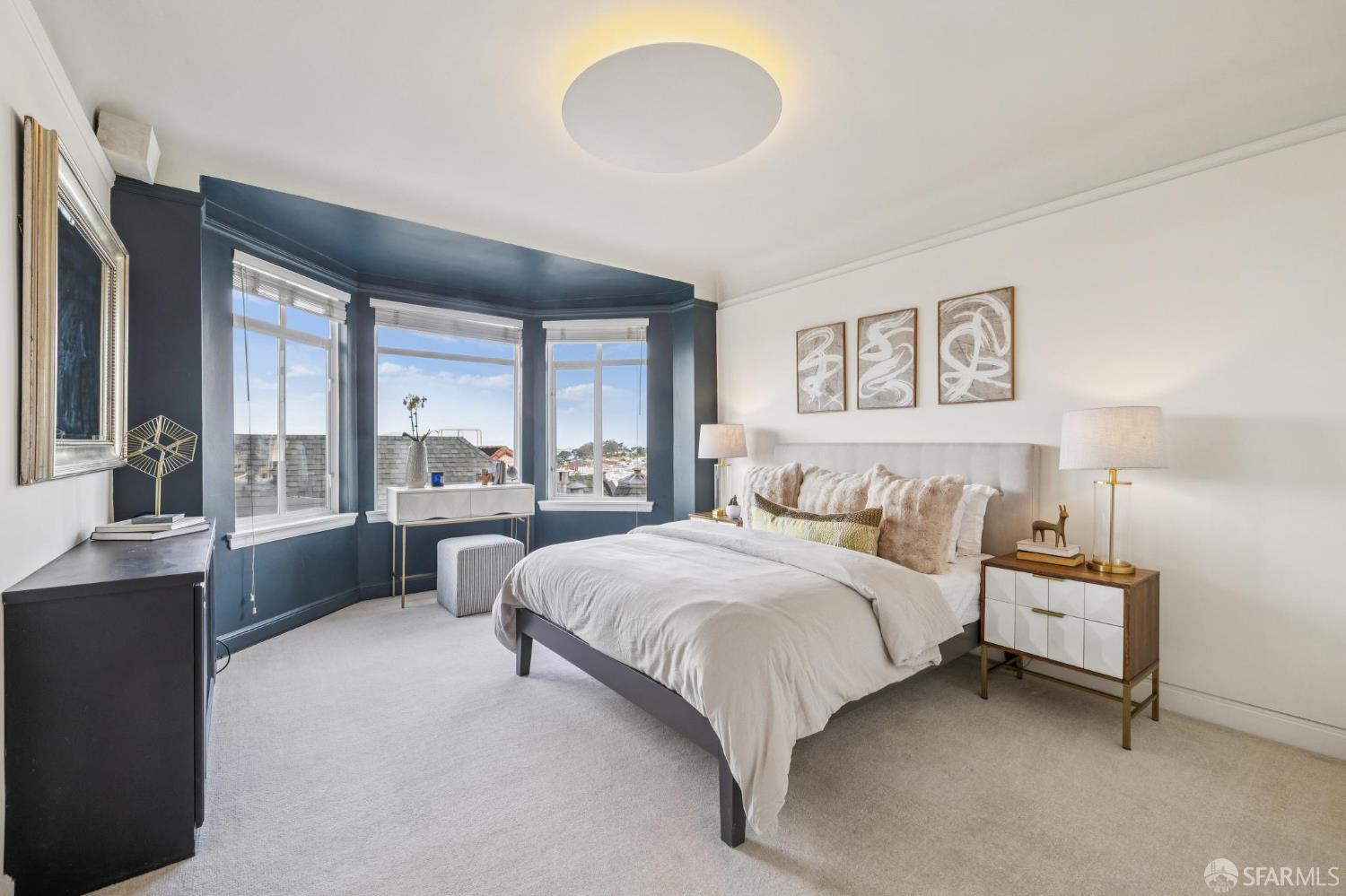 2100 Green Street, Unit 206 San Francisco, CA 94123 - Photo 23 of 33 a spacious bedroom with a bed and a large window