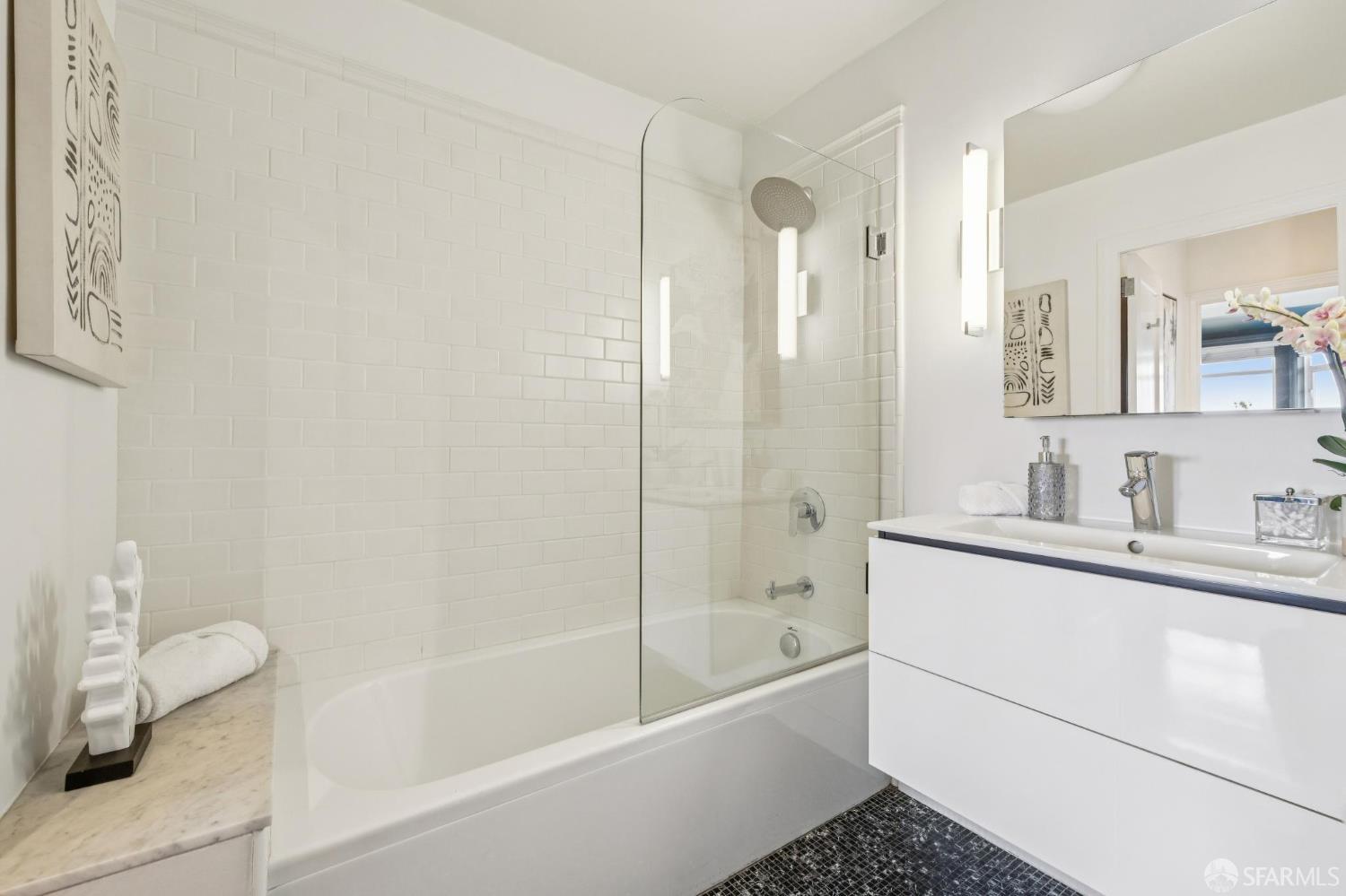 2100 Green Street, Unit 206 San Francisco, CA 94123 - Photo 28 of 33 a bathroom with a bathtub shower sink and toilet