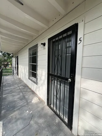 a view of a porch of a house