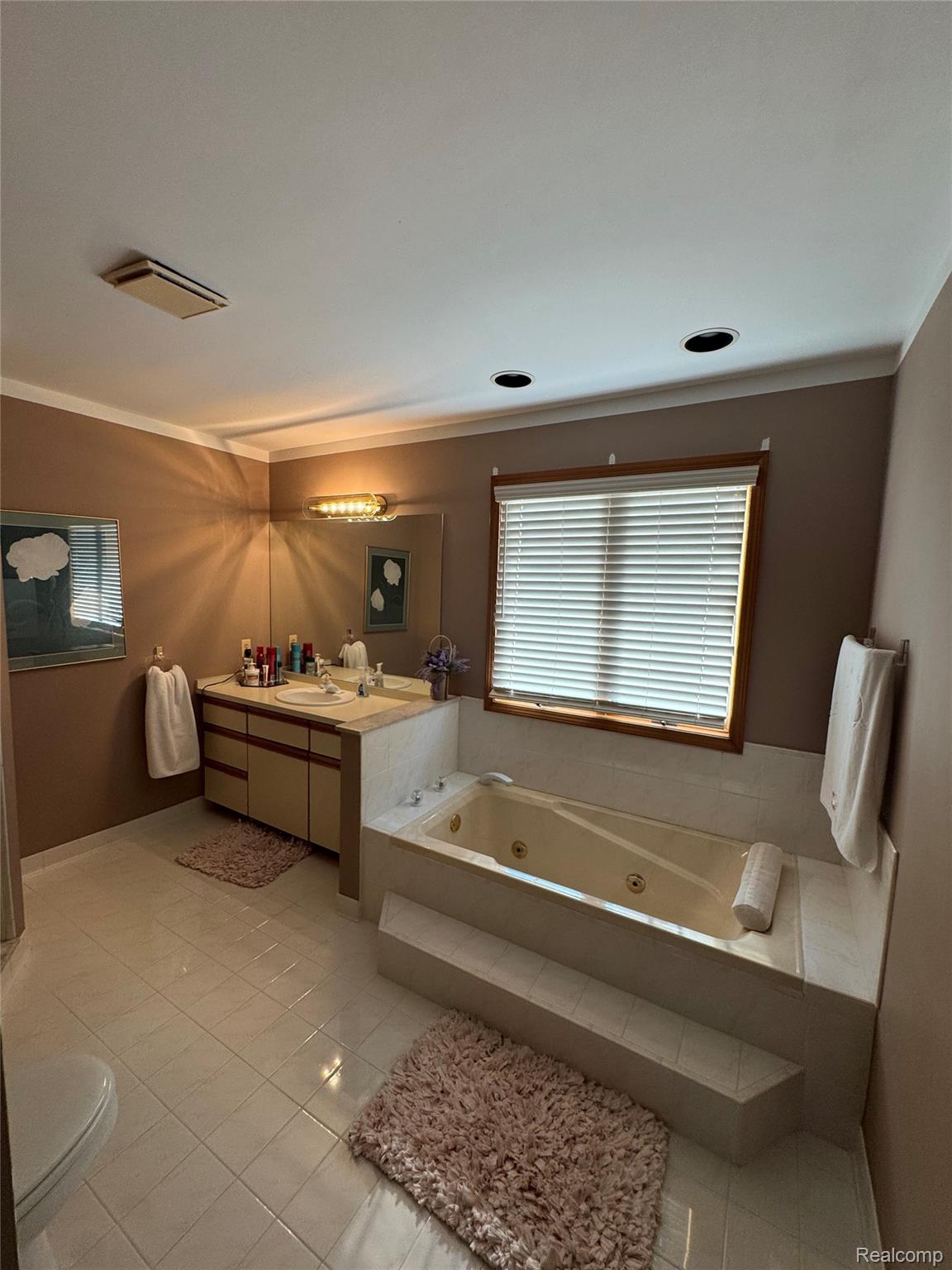 48583 Tilch Road Macomb, MI 48044 - Photo 37 of 53 Full bath with vanity, a jetted tub, and light tile patterned floors