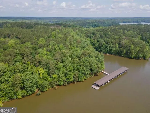 an aerial view of a houses with a yard
