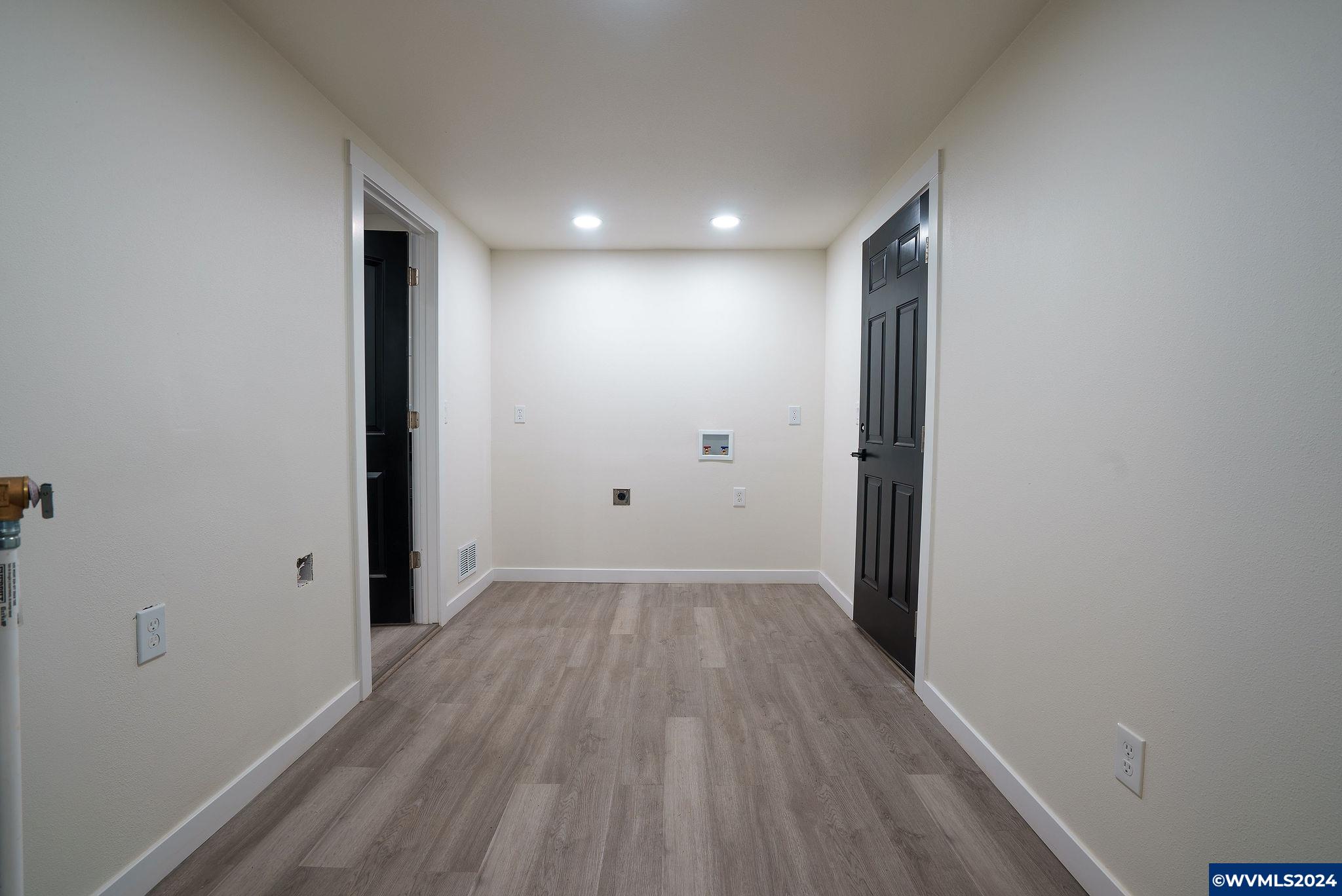 5085 Windsor Island Road North Keizer, OR 97303 - Photo 20 of 22 a view of hallway with wooden floor