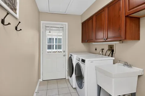 a spacious bedroom with a bed and a cabinets