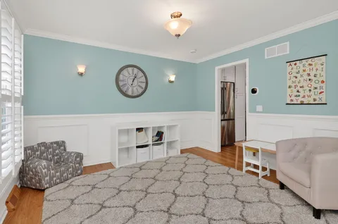 a view of entryway and hall with wooden floor