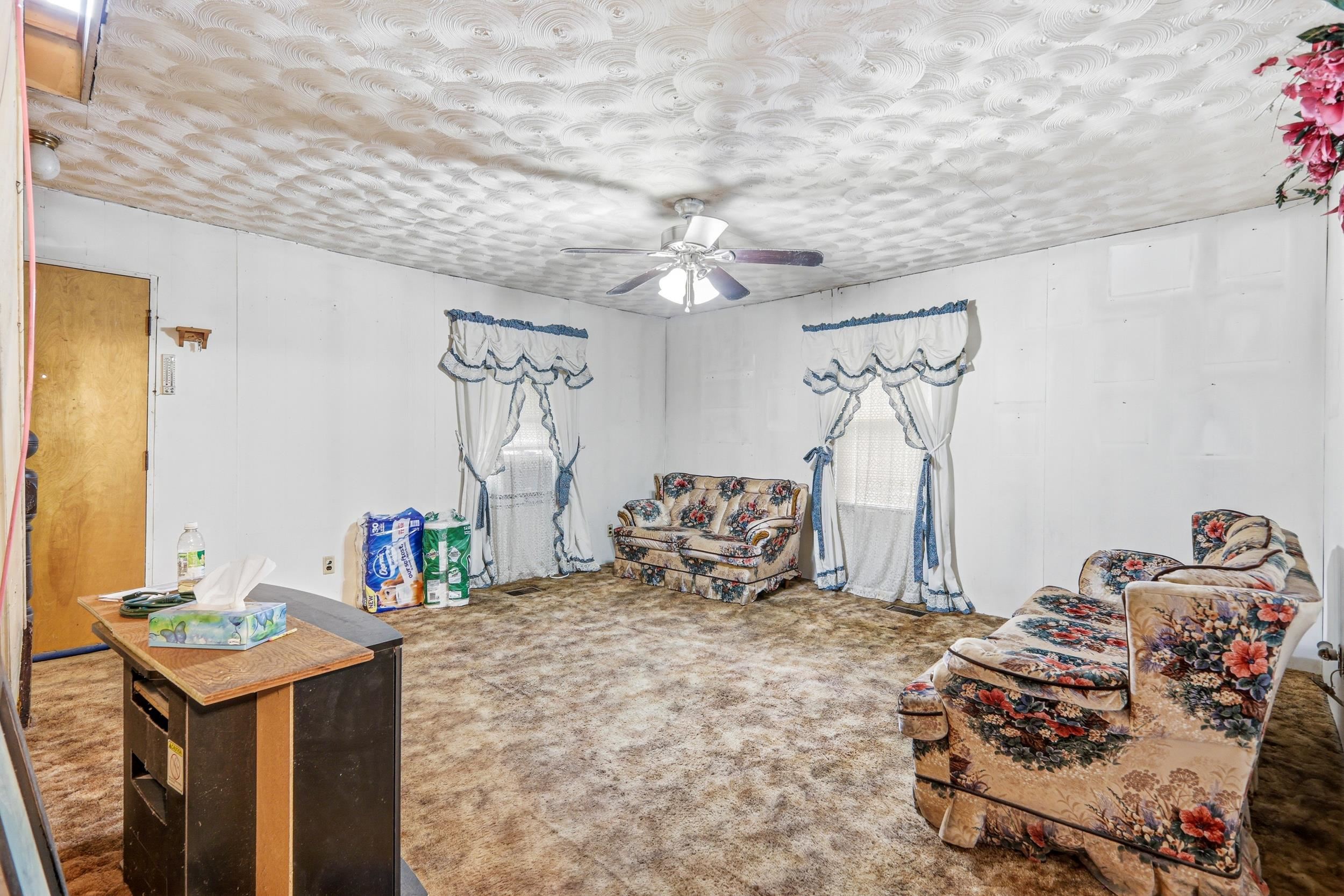 13896 Rockingham Pike Elkton, VA 22827 - Photo 29 of 60 a bedroom with a bed and a chandelier