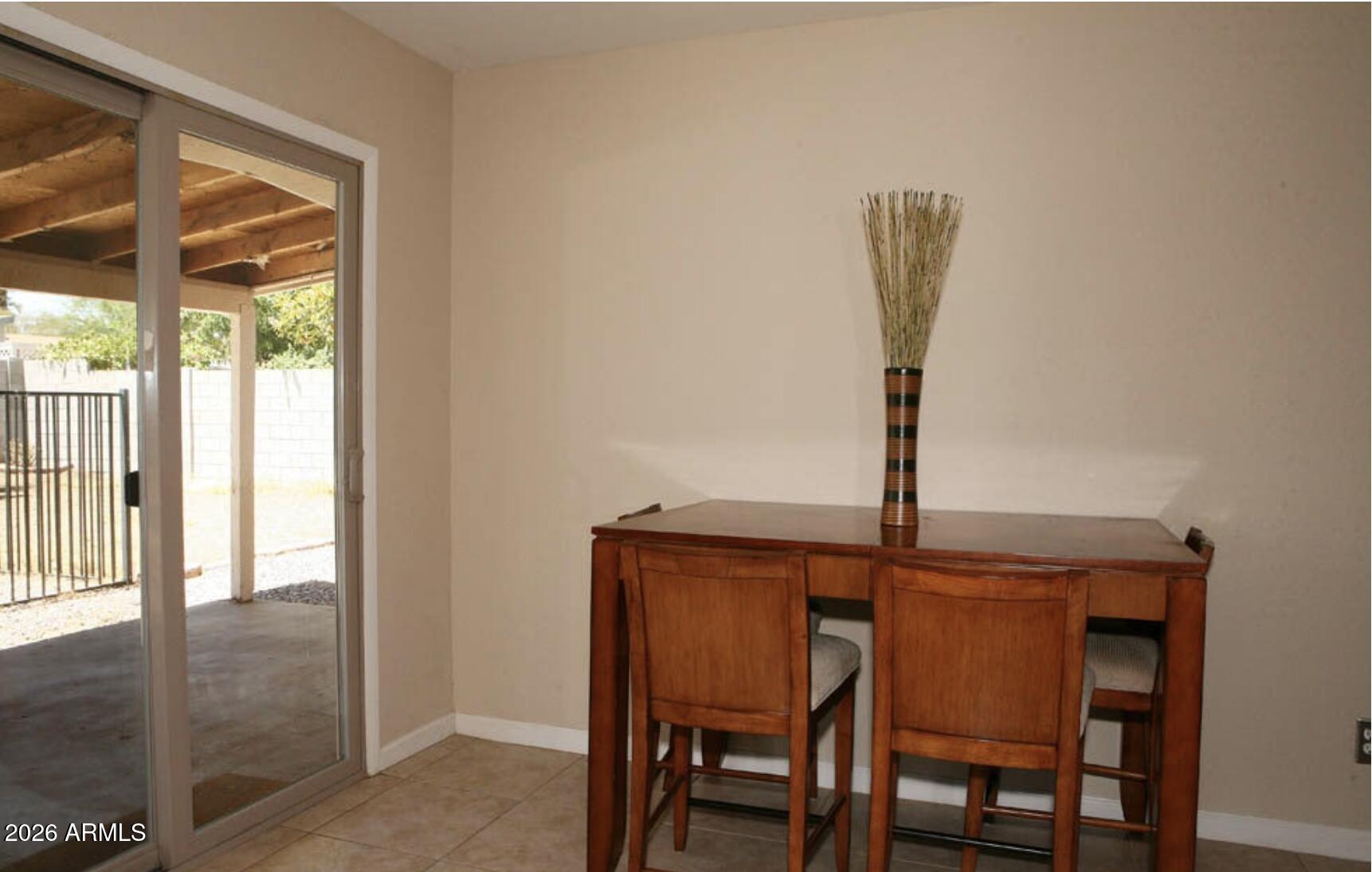 911 West Colgate Drive Tempe, AZ 85283 - Photo 7 of 15 a dining room with furniture and window