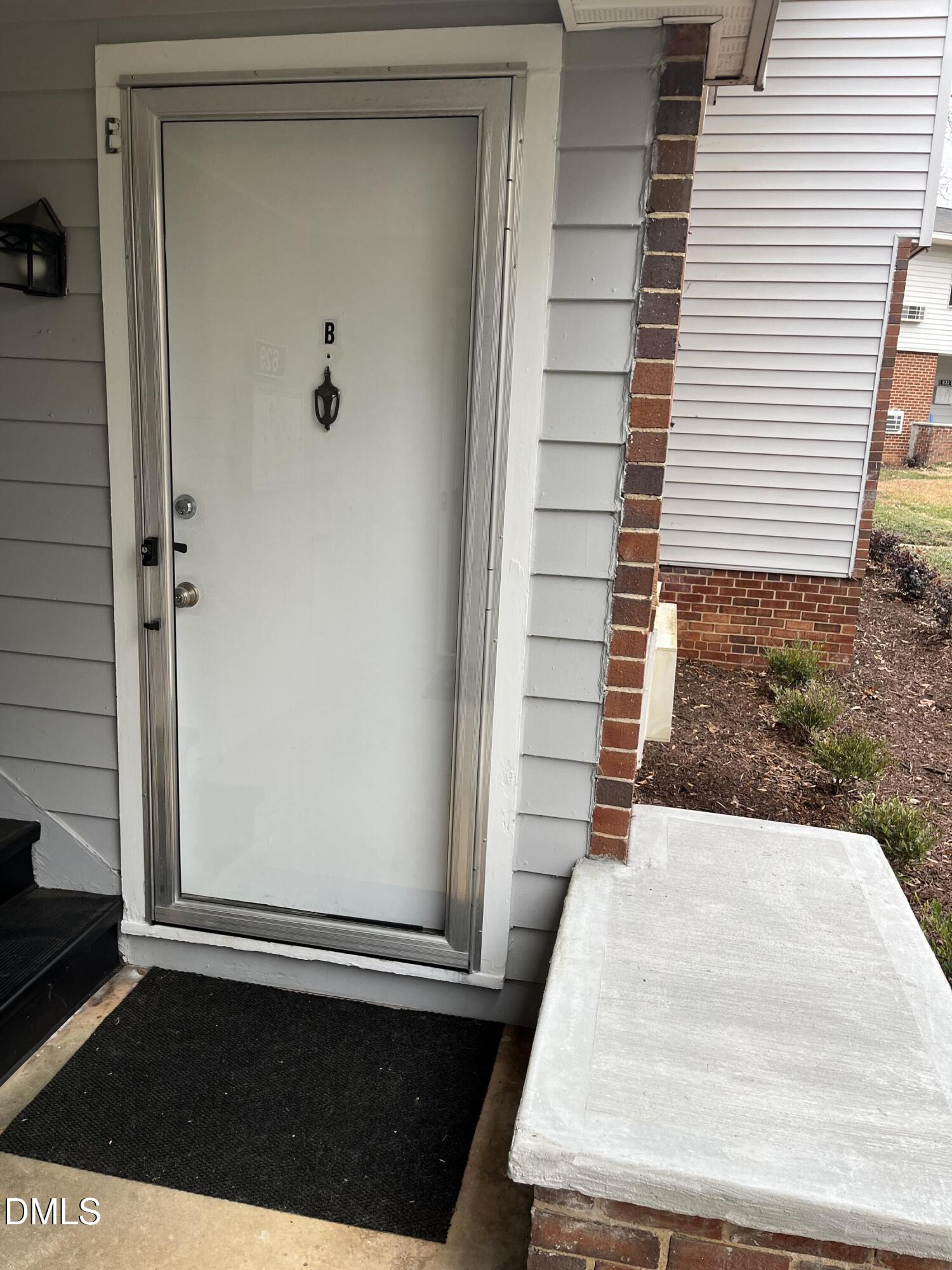 629 Daniels Street, Unit B Raleigh, NC 27605 - Photo 3 of 8 a view of a balcony with door