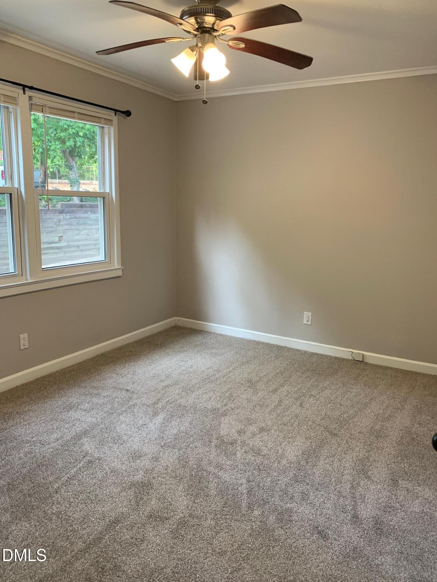 629 Daniels Street, Unit B Raleigh, NC 27605 - Photo 8 of 8 a view of an empty room with a window