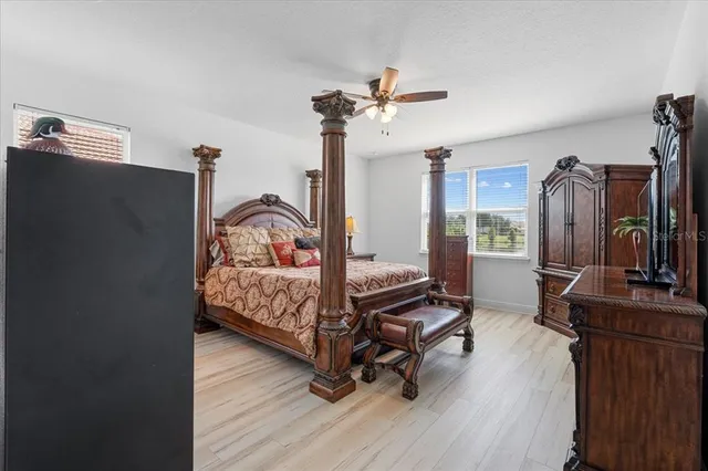 a bedroom with furniture and a window