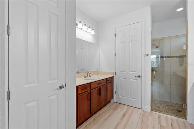 a view of a bathroom with a sink and a mirror