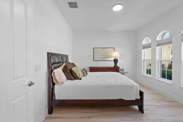 a bedroom with a bed and window