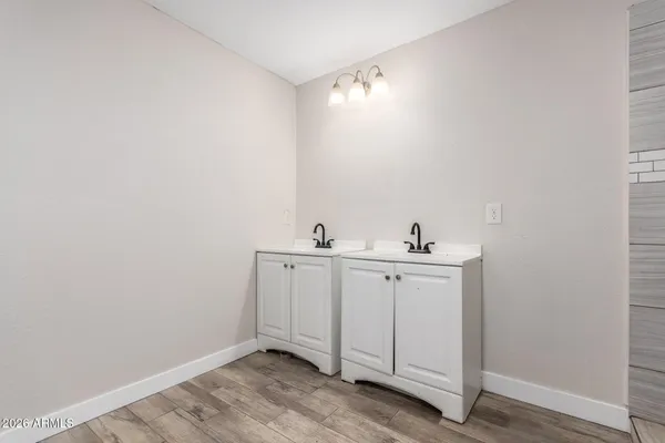 a view of utility room with two sink
