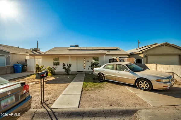 a view of a car park in front of house