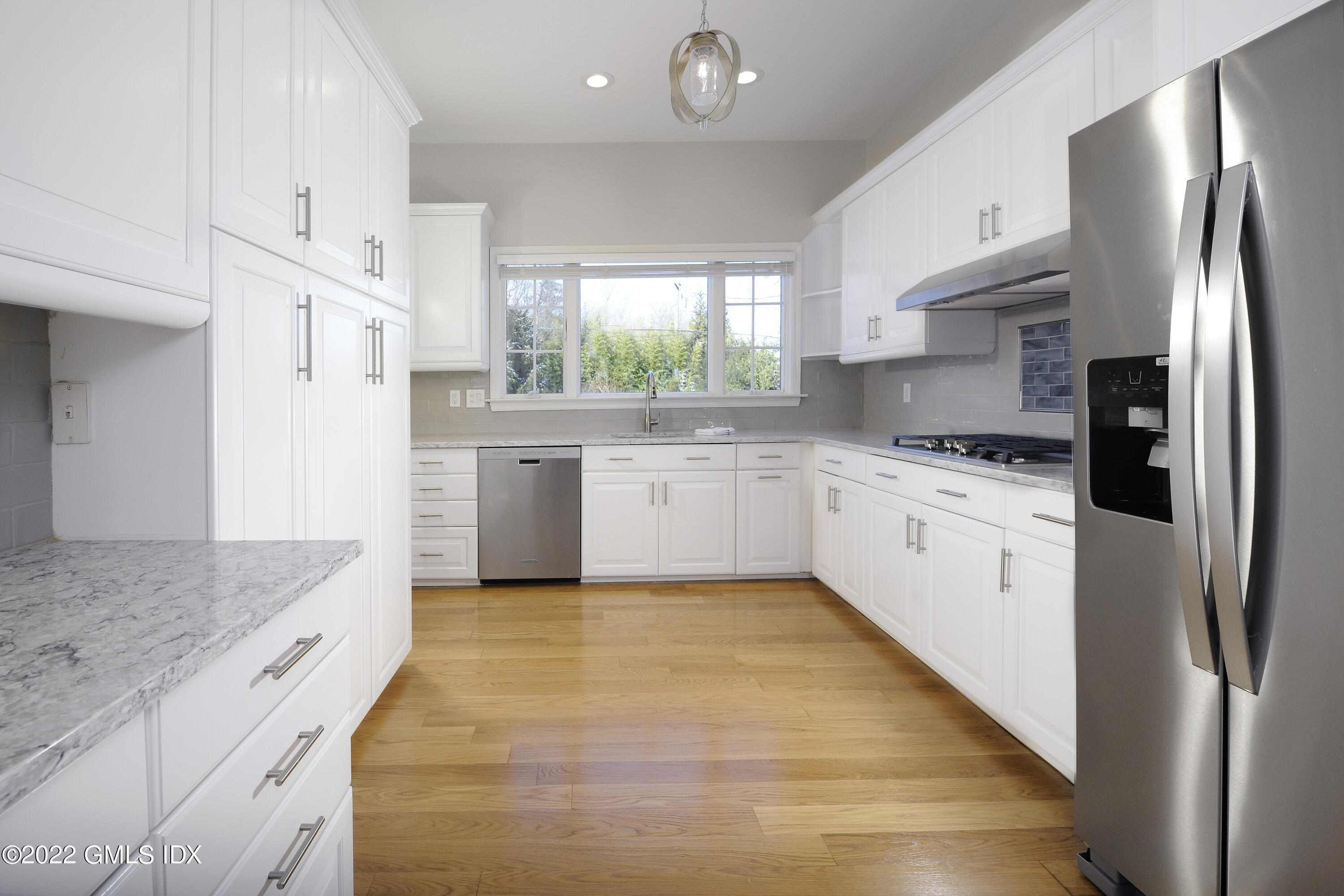 5 Anderson Road Greenwich, CT 06830 - Photo 12 of 31 a large kitchen with stainless steel appliances granite countertop a stove a sink dishwasher and a refrigerator