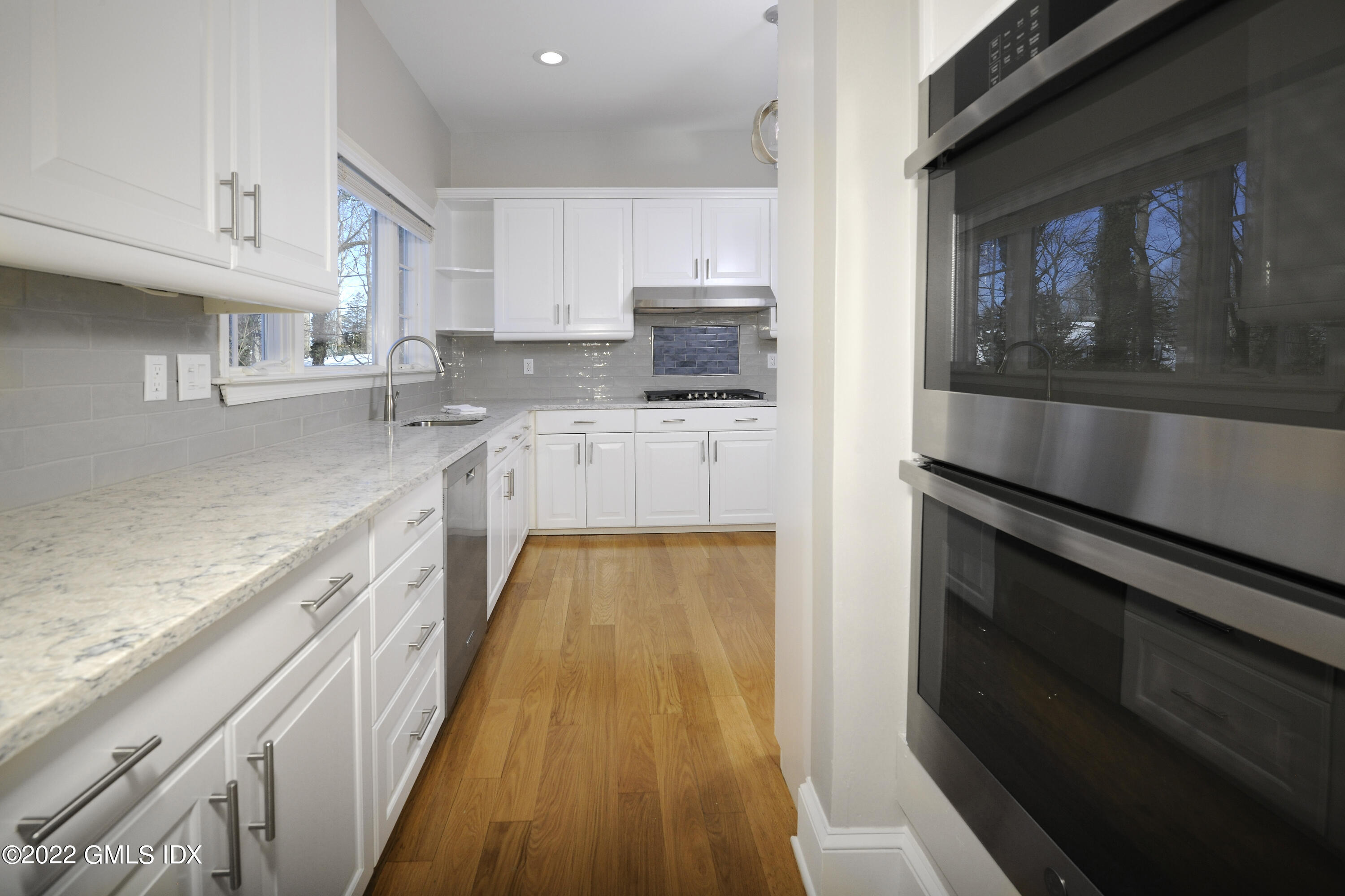 5 Anderson Road Greenwich, CT 06830 - Photo 14 of 31 a kitchen with a sink stove and cabinets