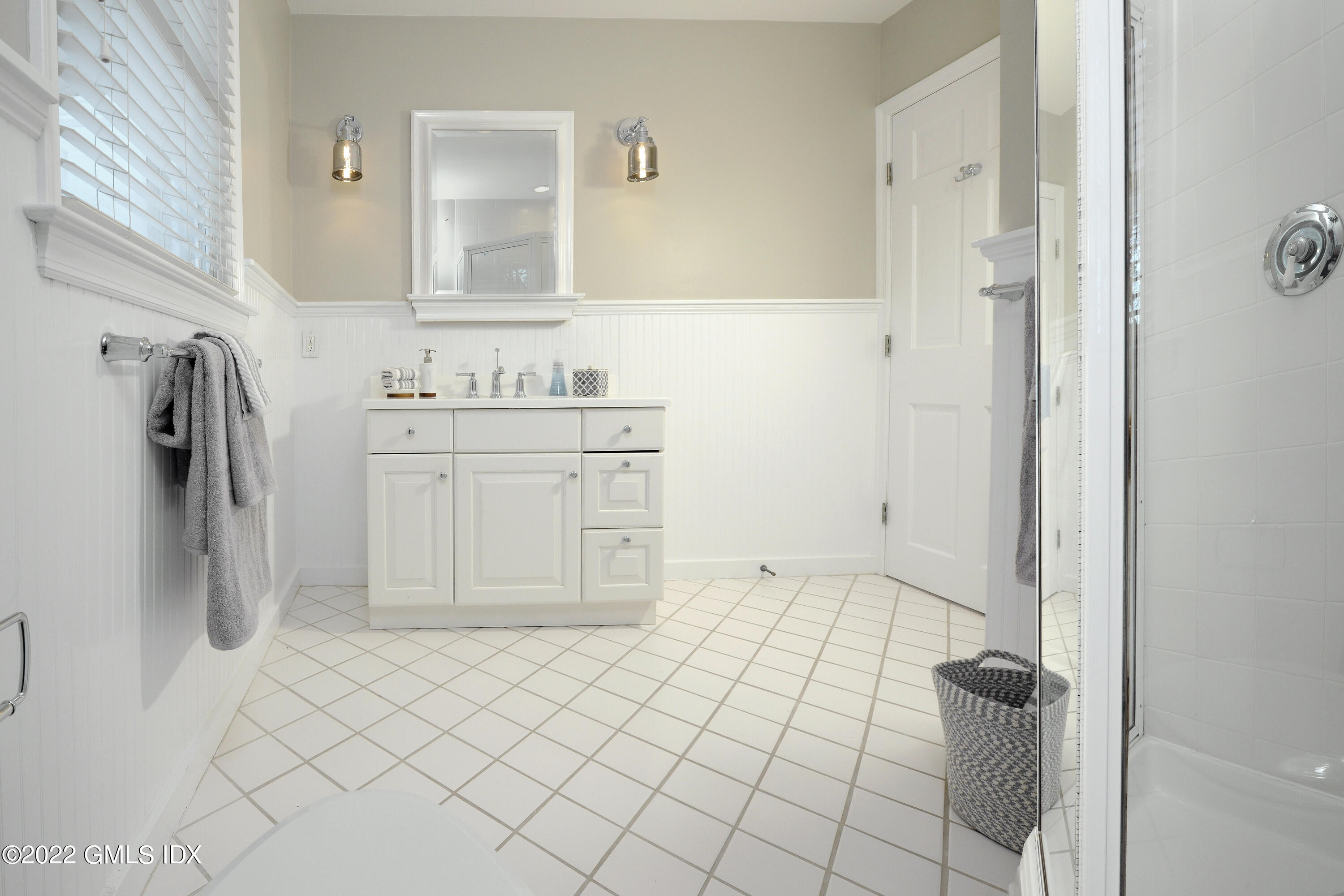 5 Anderson Road Greenwich, CT 06830 - Photo 19 of 31 a bathroom with a granite countertop sink a toilet and a mirror