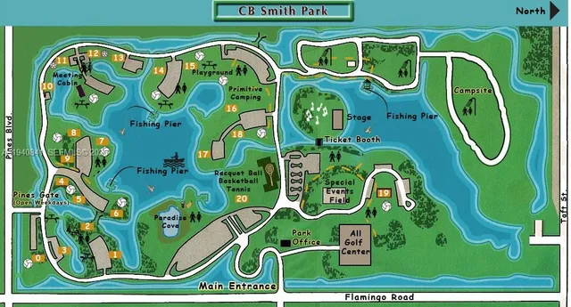 a view of swimming pool with a garden in the background