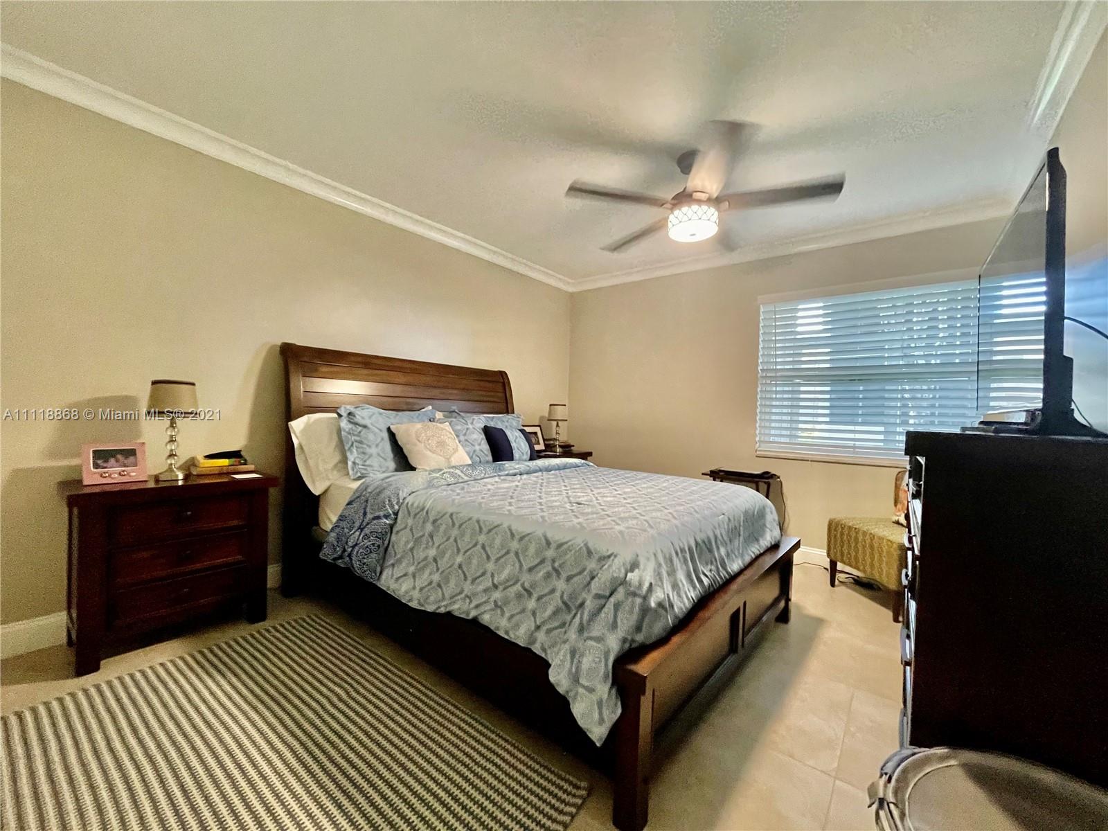 Kings Point Piedmont Delray Beach, FL 33484 - Photo 17 of 22 a bedroom with a bed dresser and a window