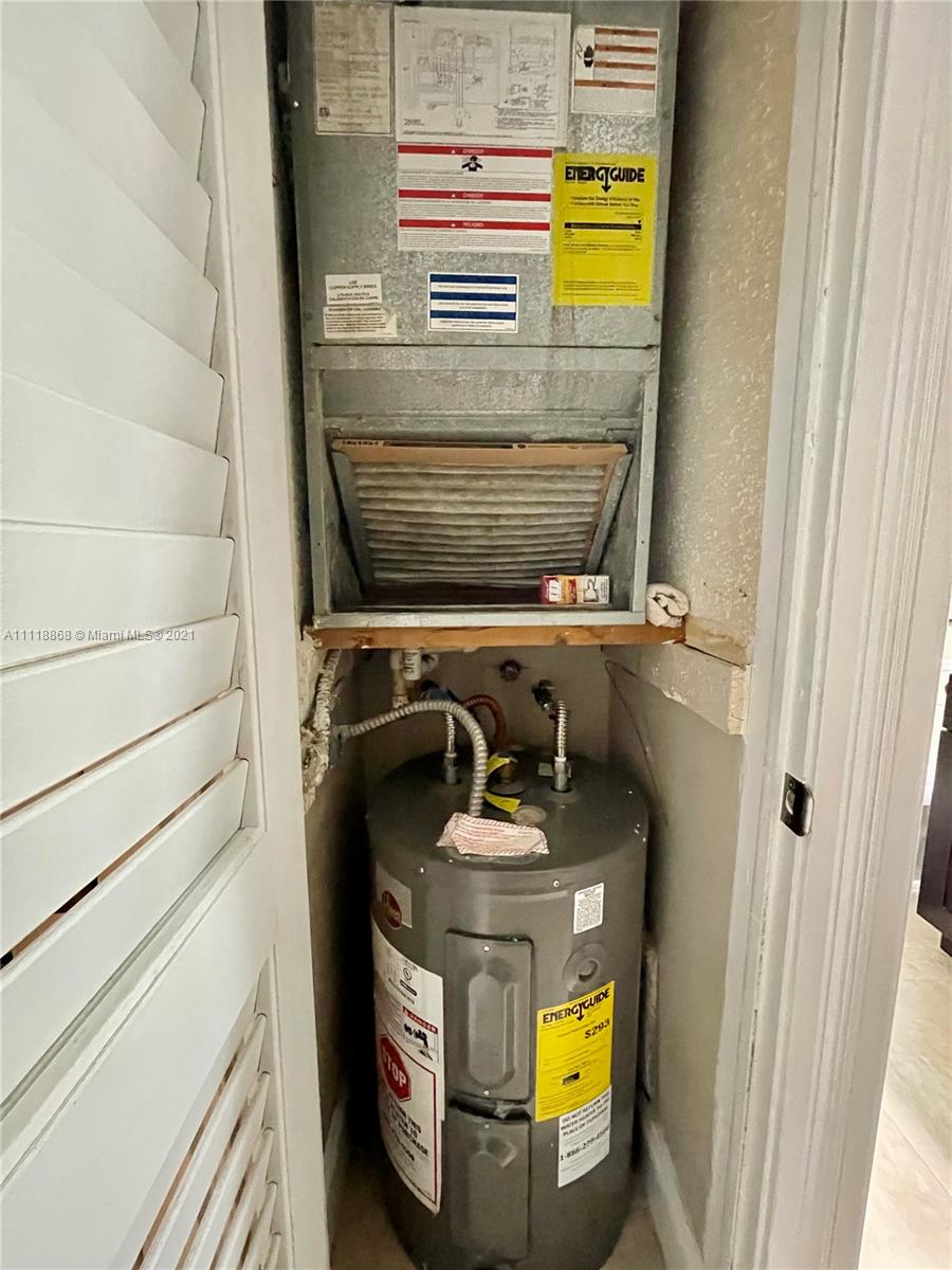 Kings Point Piedmont Delray Beach, FL 33484 - Photo 19 of 22 a utility room with dryer and washer