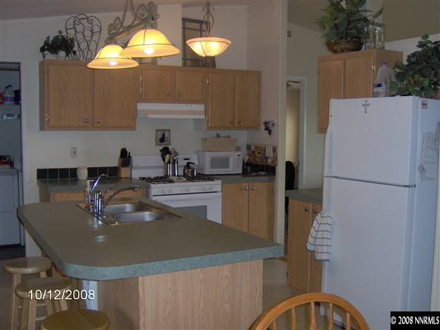 5770 Sarah Road Fallon, NV 89406 - Photo 4 of 9 a kitchen with a sink stainless steel appliances and cabinets