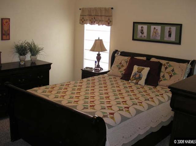 5770 Sarah Road Fallon, NV 89406 - Photo 7 of 9 a bedroom with a bed and a window