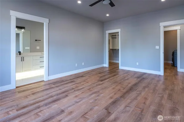 a view of walk in closet with empty racks