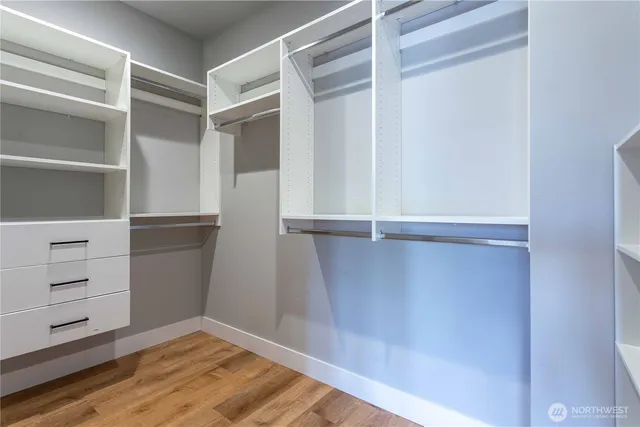 a bathroom with a granite countertop sink a shower and a mirror