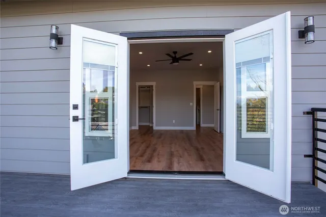 a view of a balcony with wooden floor and stairs