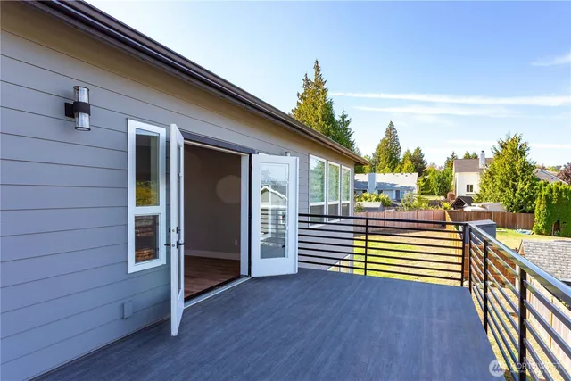 a view of a hallway with wooden floor and closet