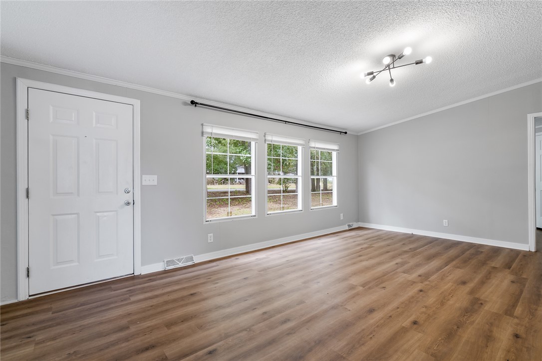 120 Old Brickyard Road Pelzer, SC 29669 - Photo 2 of 27 Enter into the spacious living room.
