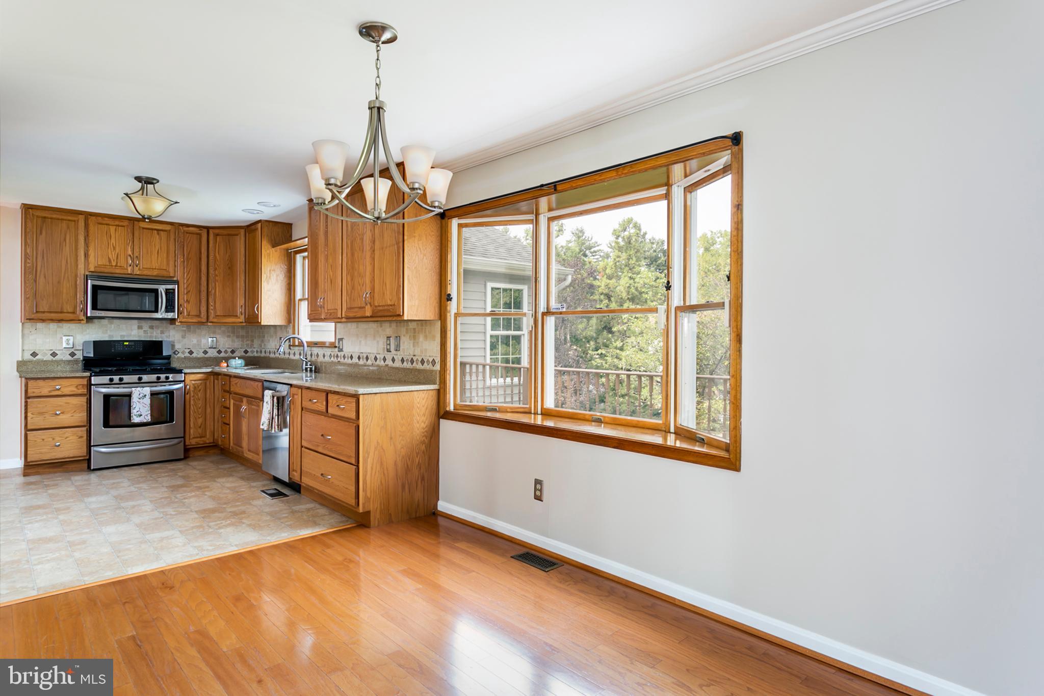6300 Homewood Road Linthicum, MD 21090 - Photo 7 of 46 Breakfast area with view of tree-lined property!