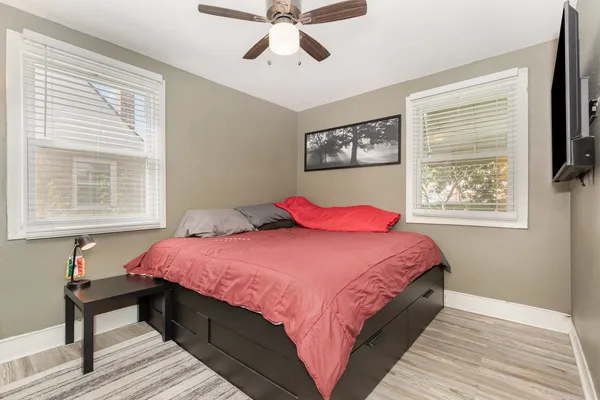 a bedroom with bed and a window