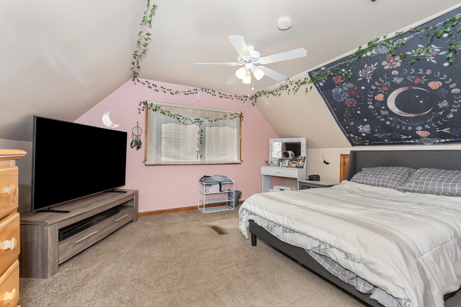 17518 Roy Street Lansing, IL 60438 - Photo 10 of 17 a bedroom with a bed and a flat screen tv