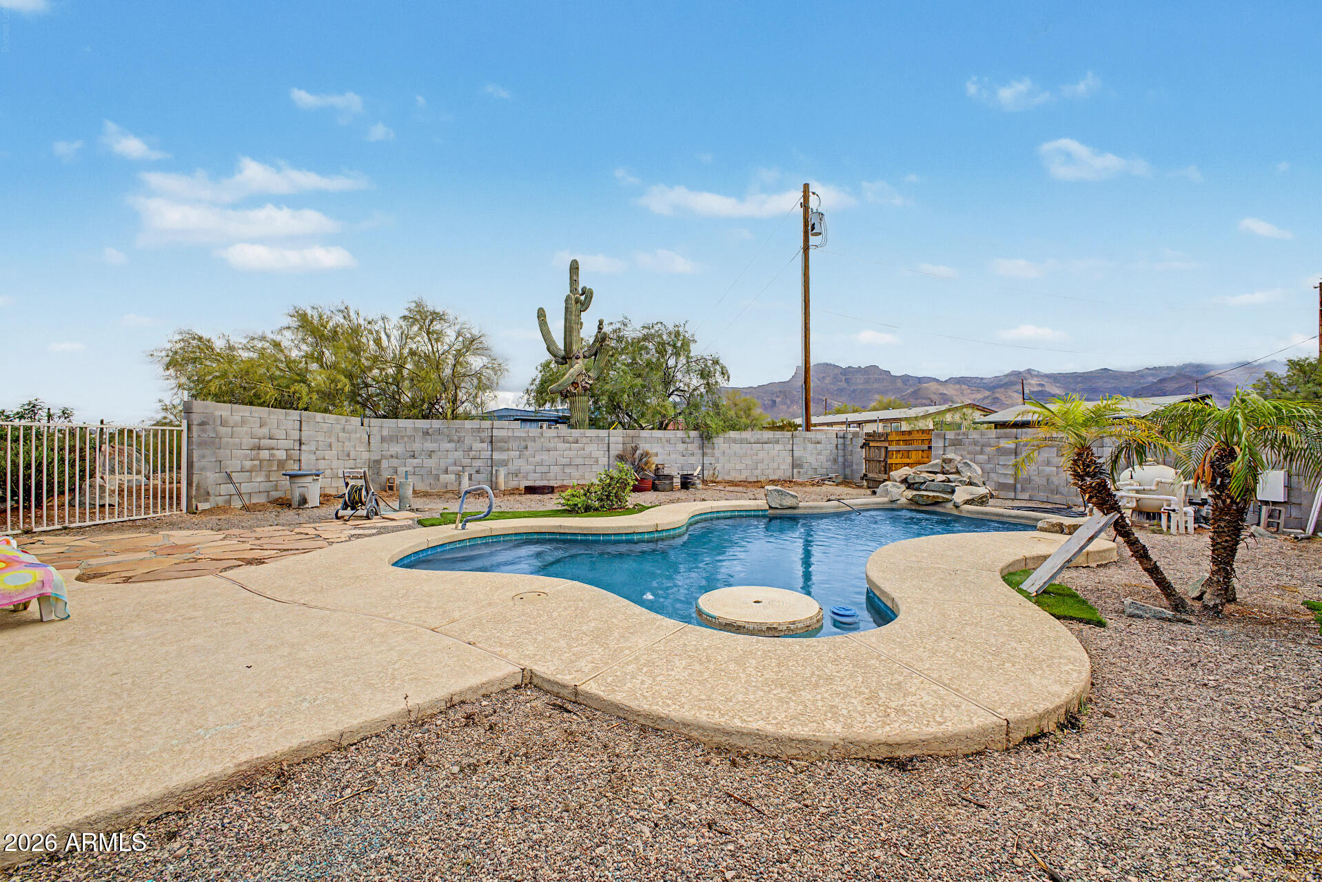 2548 South Val Vista Road Apache Junction, AZ 85119 - Photo 2 of 29 a view of a swimming pool with a patio