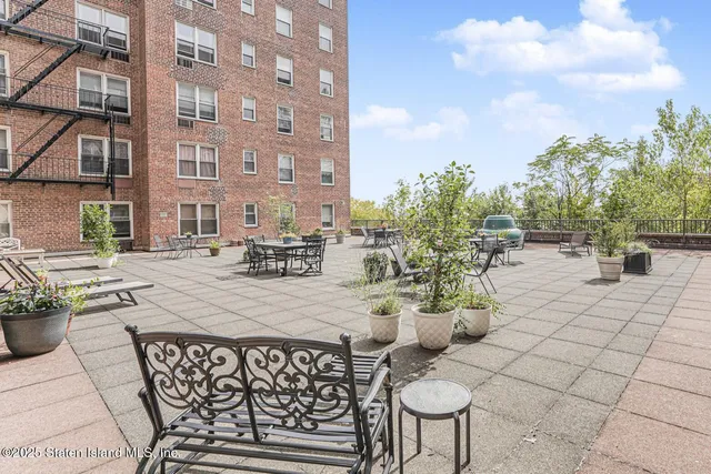 a view of a building with sitting area