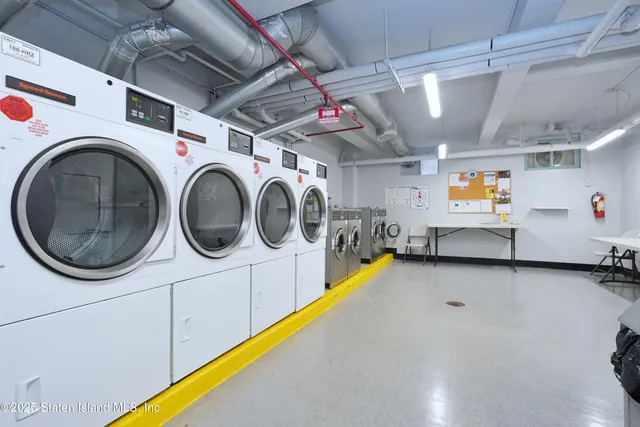 a dining room with furniture and a rug