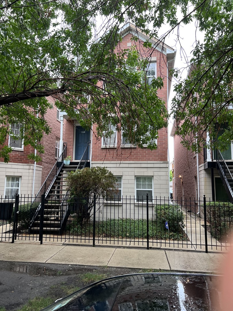 front view of a house with a small yard