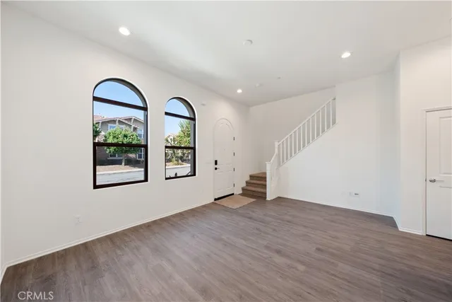 a view of kitchen with wooden floor and electronic appliances
