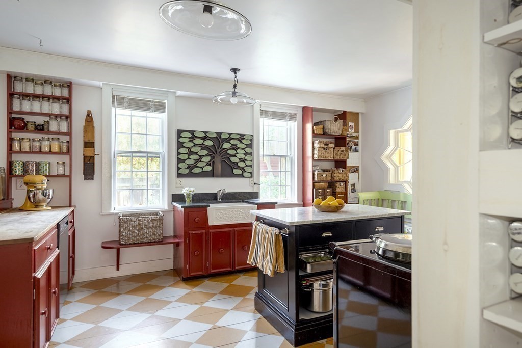 88 County Road Ipswich, MA 01938 - Photo 13 of 40 a kitchen with a stove a sink and a window