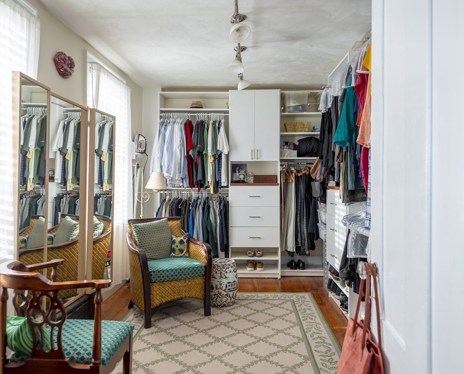 88 County Road Ipswich, MA 01938 - Photo 17 of 40 a view of walk in closet with clothes and shoes