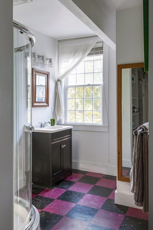 88 County Road Ipswich, MA 01938 - Photo 18 of 40 a spacious bathroom with a granite countertop sink and a mirror