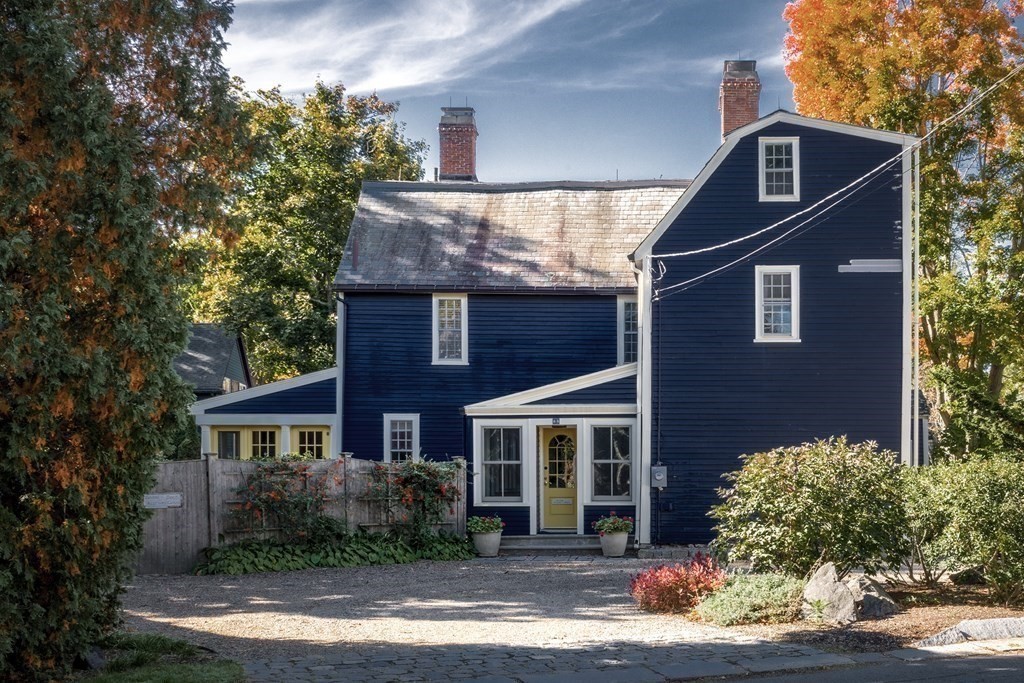 88 County Road Ipswich, MA 01938 - Photo 24 of 40 a front view of a house with a yard and garage